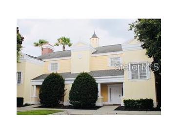 Elegant two-story townhouse with manicured landscaping at 1304 Seven Eagles Ct # 1304, Reunion, FL 34747