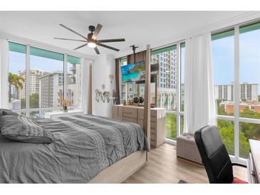 Main bedroom with king-size bed, city views, and a desk area at 322 E Central Blvd # 710, Orlando, FL 32801