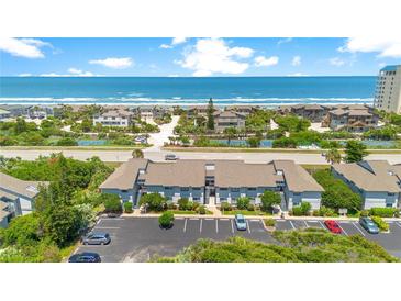 Aerial view of condo community near beach with tennis courts at 4407 Sea Mist Ct # 267, New Smyrna Beach, FL 32169