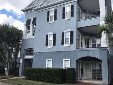 Three-story building with light blue exterior at 3561 Conroy Rd # 227, Orlando, FL 32839