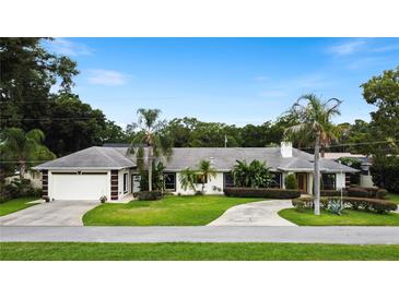 Single-Gathering home with a two-car garage and circular driveway at 342 Maple Dr, Longwood, FL 32750