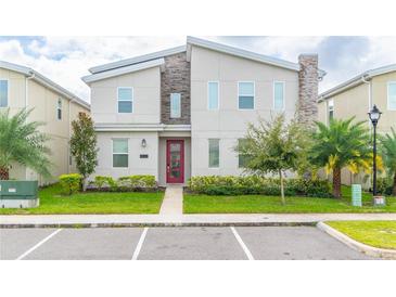 Modern two-story home with landscaping at 4562 Narrative Ln, Kissimmee, FL 34746