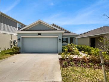 Two car garage and front yard at 6931 Wilson Pasture Ave, Groveland, FL 34736