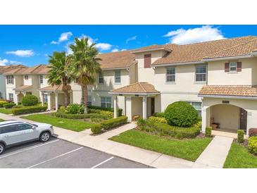 Townhouses with attractive landscaping and parking at 4805 Clock Tower Dr, Kissimmee, FL 34746