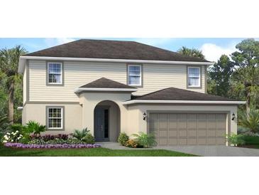 Two-story house with beige siding, gray roof, and landscaping at 2288 Sirena Ln, Mount Dora, FL 32757