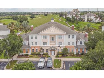 Luxury condo building with golf course views at 7673 Heritage Crossing Way # 101, Reunion, FL 34747