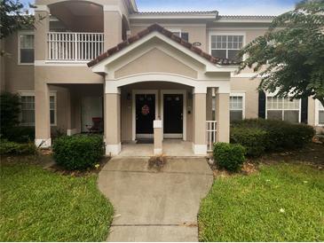 Two-story building exterior with inviting entryway and landscaping at 2323 Arbor Lakes Cir # 2323, Sanford, FL 32771