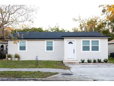 Newly renovated single story home with a modern exterior and landscaped yard at 2070 W Airport Blvd, Sanford, FL 32771