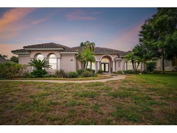Beautiful one-story home with tile roof and landscaping at 445 Hightower Dr, Debary, FL 32713
