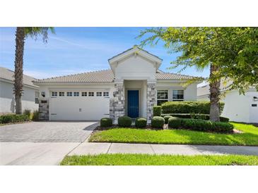 Charming one-story home with gray stone accents at 1411 Clubman Dr, Davenport, FL 33896