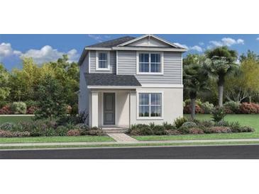 Two-story house with gray siding, landscaping, and a walkway at 2432 Cedar Rose St, Apopka, FL 32712