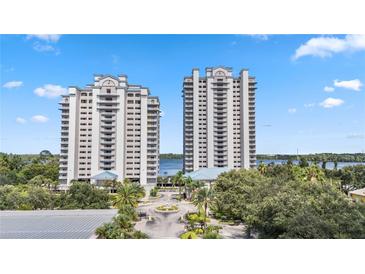 Two high rise waterfront buildings with parking and landscaping at 13427 Blue Heron Beach Dr # 405, Orlando, FL 32821