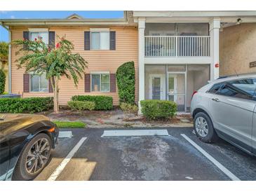 Building exterior featuring parking and landscaping at 165 N Pearl Lake Cswy # 100, Altamonte Springs, FL 32714