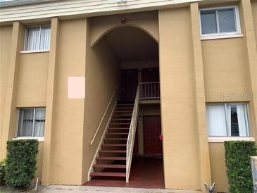 Building exterior with stairs and entrance at 1000 Lake Of The Woods Blvd # C205, Fern Park, FL 32730