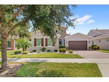 Beautiful two-story home with landscaped yard at 290 Silver Maple Rd, Groveland, FL 34736