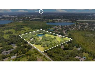 Aerial view of house and surrounding land at 12151 Walker Pond Rd, Winter Garden, FL 34787