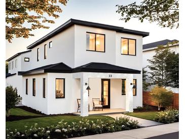 Stunning two-story modern home with white exterior and black accents at 33 S Graham Ave, Orlando, FL 32803