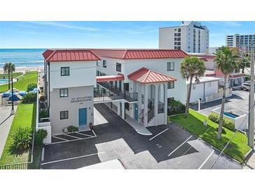 Oceanfront condo building with balconies and parking at 1404 N Atlantic Ave # 4, Daytona Beach, FL 32118