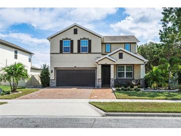 Two-story house with a two-car garage at 5200 Landmark Dr, St Cloud, FL 34771