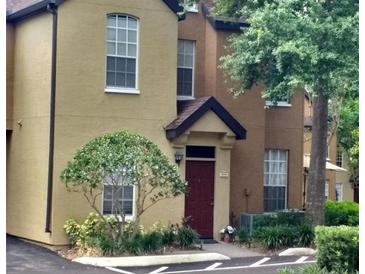 Exterior view of a two-story townhome at 6320 Raleigh St # 604, Orlando, FL 32835