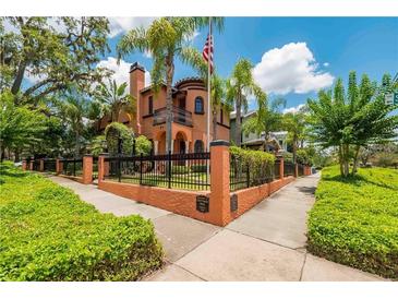Beautiful two-story home with manicured landscaping and a gated entrance at 503 N Summerlin Ave, Orlando, FL 32803