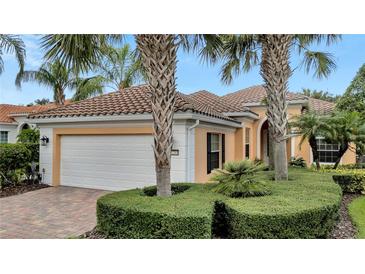One-story house with a white garage door and brick driveway at 12203 Pasha Ln, Orlando, FL 32827