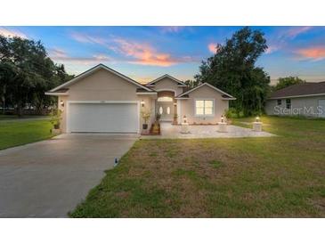 Beautiful one-story home with a large yard and a two-car garage at 17279 Peggy Ave, Mount Dora, FL 32757