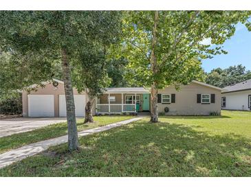 House exterior with two-car garage and front yard at 233 S 4Th St, Lake Mary, FL 32746