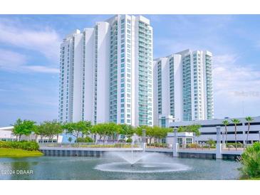 Luxury high-rise building with waterfront views and fountain at 231 Riverside Drive # 101-1, Holly Hill, FL 32117