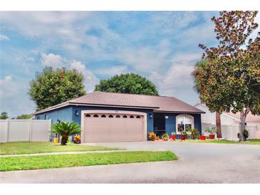 Charming curb appeal with two-car garage and landscaped yard at 2019 Jaffa Ct, Clermont, FL 34714