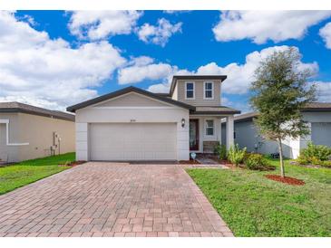 Two-story house with a modern facade and landscaped yard at 2370 Brassie Ct, Winter Haven, FL 33884