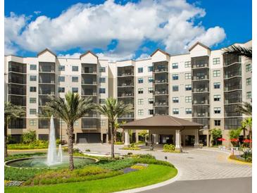 Multi-story building with a fountain and covered entrance at 14501 Grove Resort Ave # 3137, Winter Garden, FL 34787