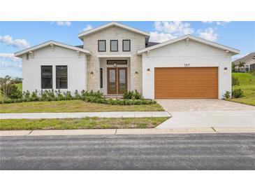 Modern two-story home with attached garage at 197 Valencia Ridge Dr, Auburndale, FL 33823