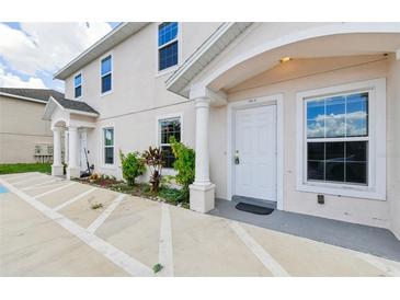 Two story building exterior with front entrance and landscaping at 210 Majors Ln # B, Kissimmee, FL 34743