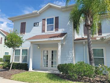Light blue two story building with brown trim at 8959 Shine Dr, Kissimmee, FL 34747