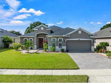One-story house with a gray exterior and a two-car garage at 4814 Terra Sole Pl, St Cloud, FL 34771