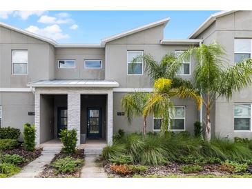 Modern townhouse exterior with landscaping at 1224 Challenge Dr, Davenport, FL 33896