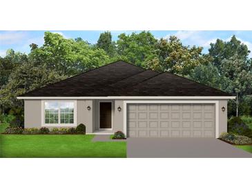 One-story home with gray siding, two-car garage, and landscaping at 4350 Sagefield Dr, St Cloud, FL 34773
