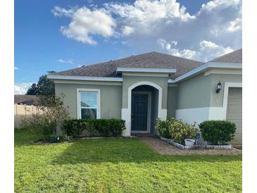 One story house with a well maintained lawn at 2581 Wadeview Loop, Saint Cloud, FL 34769