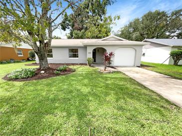 Newly renovated home with a landscaped front yard and driveway at 2604 S Marshall Ave, Sanford, FL 32773