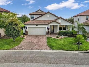 Two-story house with brick driveway at 1890 Altavista Cir, Lakeland, FL 33810