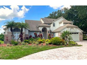 Two-story house with landscaped front yard at 6659 Crenshaw Dr, Orlando, FL 32835