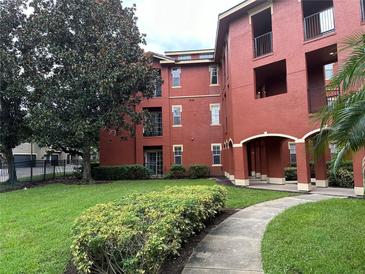 Exterior of a red brick building with landscaping and walkways at , Lake Mary, FL 32746
