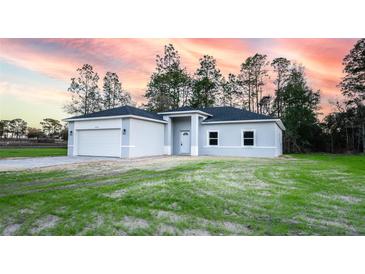 One-story home with attached garage and spacious yard at 4455 Se 24Th St, Ocala, FL 34471