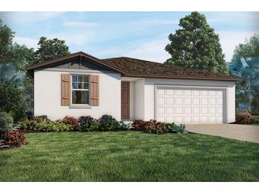 One-story house with a two-car garage and landscaping at 3514 Rutland Ln, Haines City, FL 33844