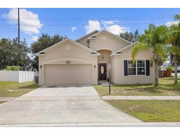 Two-story house with a two car garage at 3216 Lynrock Ave, Dundee, FL 33838