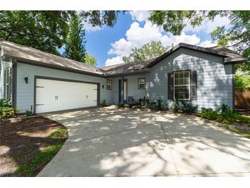 Newly renovated light blue house with a two car garage at 5525 Barma St, Orlando, FL 32807