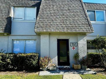 House exterior with front door and plants at 1944 Conway Rd # 2, Orlando, FL 32812