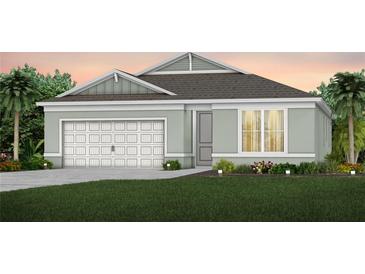 Charming one-story home with two-car garage and landscaped lawn at 3087 Norcott Dr, Davenport, FL 33837
