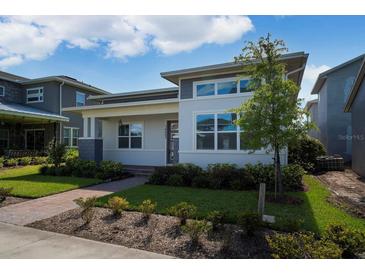 Modern house exterior with gray and white siding at 14663 Englert Aly, Orlando, FL 32827